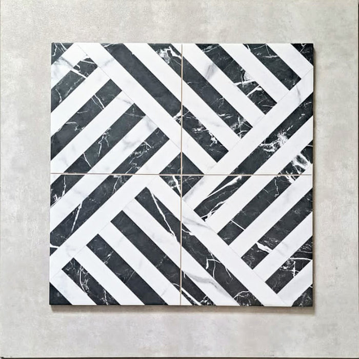 Flat lay of Decaprio Black & White marble effect patterned porcelain tiles 44 × 44cm, arranged to highlight the repeating geometric layout. The contrast between deep black marble effect segments and crisp white lines creates a bold, interlocking pattern with strong visual structure and movement.