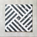 Flat lay of Decaprio Black & White marble effect patterned porcelain tiles 44 × 44cm, arranged to highlight the repeating geometric layout. The contrast between deep black marble effect segments and crisp white lines creates a bold, interlocking pattern with strong visual structure and movement.