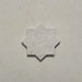 Close-up of a single Dohar Avorio Rocks Star porcelain wall and floor tile, showcasing its geometric eight-point star shape, soft ivory tone, fine speckled detail and textured matt finish.