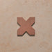 Close-up of a single Dohar Cotto Cross Moroccan style porcelain wall and floor tile, showcasing the distinctive cross shape, warm terracotta tone and soft matt finish.
