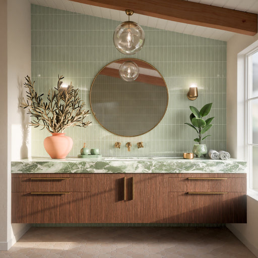 Bathroom featuring Dohar Sands Star & Cross wall and floor tiles in a warm sandy tone, paired with fluted green wall tiles, a green marble vanity, dark wood cabinetry and brass details.