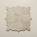 Close-up of Dohar Sands Star and Cross porcelain wall and floor tiles, showcasing the interlocking geometric design, warm sandy beige tones, speckled surface detail and subtle matt finish.
