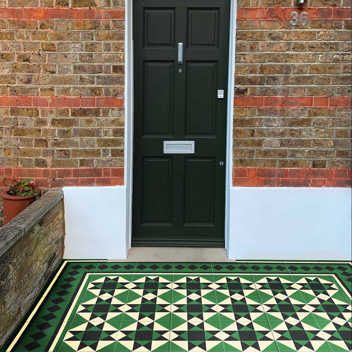Maison Green Decor Victorian Pattern 20cm x 20cm walkway setting, Victorian-style patterned floor tiles laid in a geometric diamond design, rich green, black and white colour palette, matt finish with decorative border detailing, classic heritage-inspired design used in an outdoor entrance walkway.