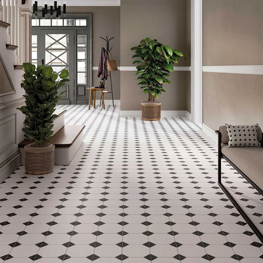 Hallway featuring Durham Black 33 × 33cm Victorian style porcelain floor tiles, creating a classic geometric pattern with black and white contrast. Paired with neutral walls and traditional details for a timeless, elegant finish.