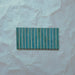 Product display of Elazar Decor Azul Blue 12.5x25cm ceramic wall tiles in vibrant blue tones, featuring a linear fluted design, handcrafted glossy finish and subtle tonal variation for textured contemporary interiors.