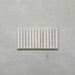 Product display of Elazar Decor Blanco 12.5x25cm ceramic wall tiles in soft white tones, featuring a linear fluted design, handcrafted glossy finish and subtle tonal variation for textured contemporary interiors.