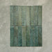 Product display of Elazar Forest Green 5x25cm glossy wall tiles in deep forest green tones, featuring handcrafted edges and rich tonal variation against a textured plaster-style backdrop.