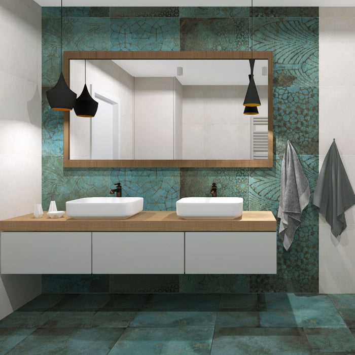 Modern bathroom featuring Elements Oxide Patterns 60cm x 60cm metallic effect porcelain wall and floor tiles, paired with a floating double vanity, timber-framed mirror, black pendant lights and contemporary styling.