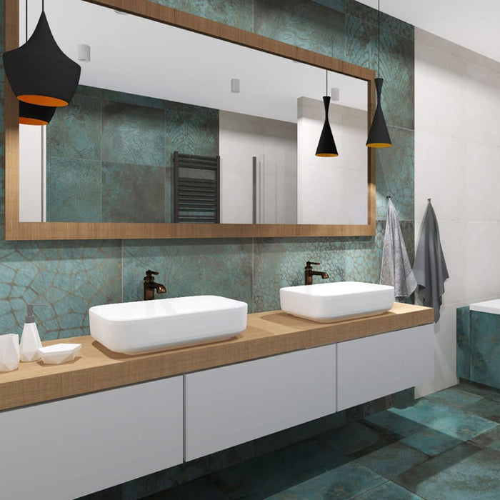 Modern bathroom featuring Elements Oxide Patterns 60cm x 60cm metallic effect porcelain wall and floor tiles, paired with a floating double vanity, timber-framed mirror, black pendant lights and contemporary styling.
