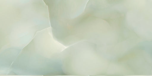 Close-up of Fantasia Jade Green Onyx Matt 60 × 120cm stone effect tile, featuring soft green tones with flowing gold and amber veining, creating a layered, organic pattern with a smooth matt finish.