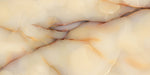 Close-up of Fantasia Miele Onyx Matt 60 × 120cm stone effect tile, featuring warm honey and cream tones with soft flowing veining, creating a natural, layered appearance with a smooth matt finish.