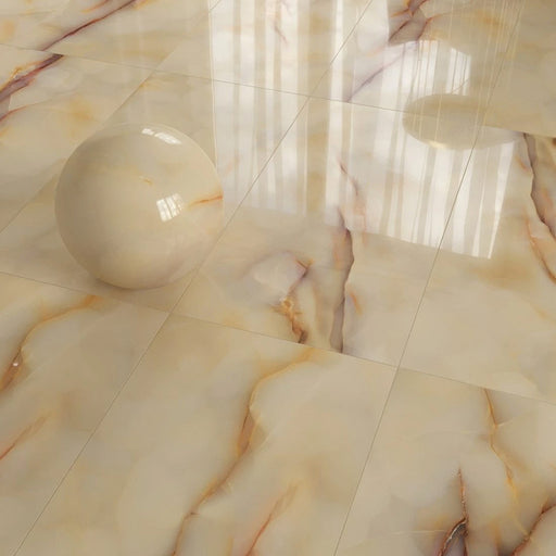 Flat lay of Fantasia Miele Onyx Polished 60 × 120cm stone effect tiles, showcasing warm honey-toned veining across a soft cream base, with a high-gloss finish that enhances depth, reflection, and the fluid, onyx-inspired movement across each tile.