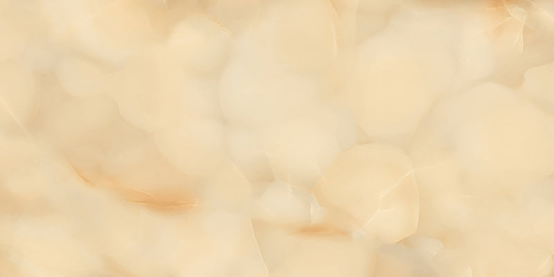 Close-up of Fantasia Miele Onyx Polished 60 × 120cm stone effect tile, featuring warm honey and cream tones with flowing gold and amber veining, creating a rich, layered pattern with a high-gloss polished finish.
