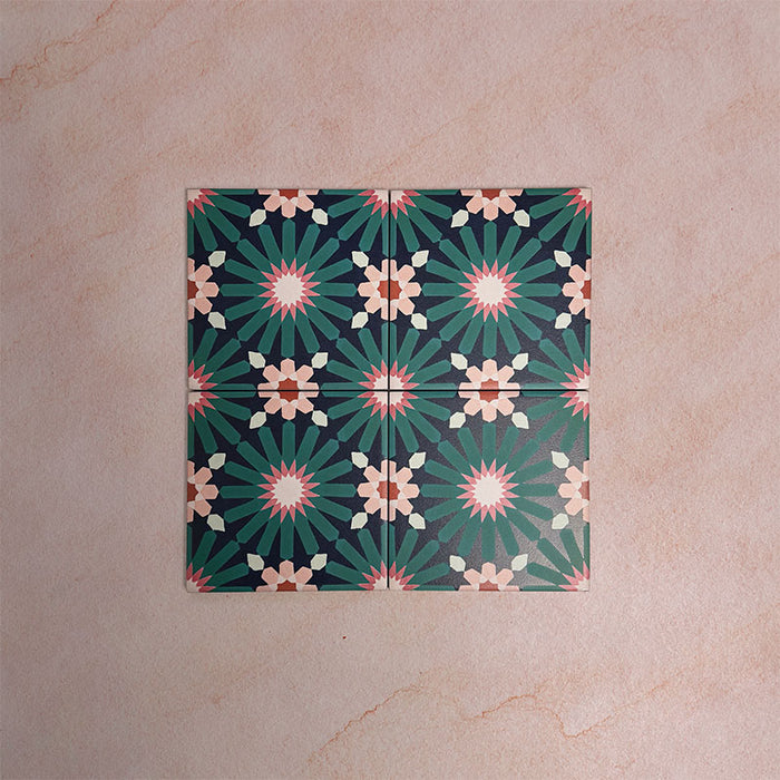 Arrangement of Fizaan Festive Blue Mini 15x15cm Moroccan-style porcelain tiles, showcasing a repeating geometric pattern in rich blue, green and soft neutral tones.