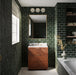 Bathroom featuring Finchley Golders Green 7.5x15cm crackle glaze wall tiles, showcasing deep glossy green tones laid in a brick pattern, paired with a herringbone walnut vanity, brass fittings, marble surfaces and built-in shelving for a timeless, luxurious finish.