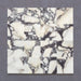 Fitzrovia Calacatta Viola honed natural marble tile in a 15.2cm x 15.2cm square format, featuring a creamy white background with bold purple veining and subtle warm gold tones, creating a luxurious and timeless natural stone finish.