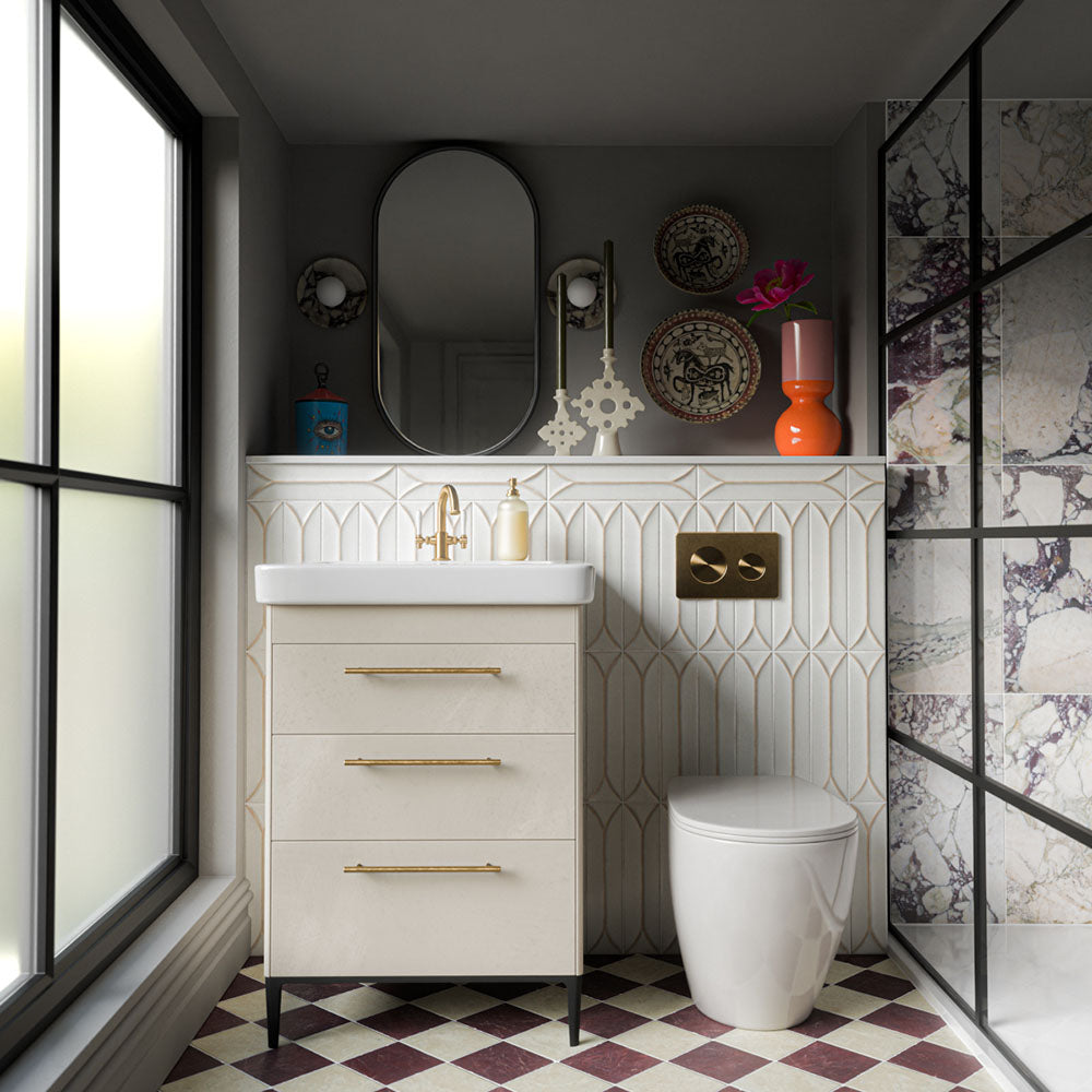 Fitzrovia Claret Red 15.2cm x 15.2cm natural marble tiles with a tumbled finish, creating a rich chequerboard floor paired with warm neutrals, sculptural wall tiles and brass detailing.