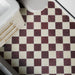 Fitzrovia Claret Red 15.2cm x 15.2cm natural marble tiles with a tumbled finish, showcasing rich burgundy tones and natural variation in a classic chequerboard floor.