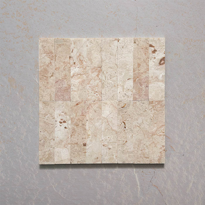 Group layout showcasing Fitzrovia Sylvester Pink 5cm x 20cm honed natural marble tiles, featuring soft pink, cream and beige tones with natural veining, creating an elegant and timeless wall tile design.