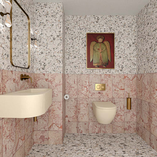 Contemporary bathroom featuring Fitzrovia Sylvester Pink honed natural marble wall tiles in 30.5cm x 61cm. Soft pink marble walls are paired with Vito Moonstone terrazzo effect porcelain floor tiles, creating a luxurious space with warm brass fittings and modern styling.