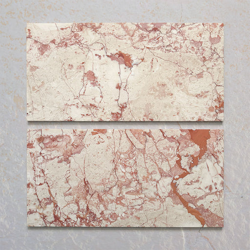 Group of two Fitzrovia Sylvester Pink honed natural marble tiles in a 30.5cm x 61cm format, showcasing natural variation with soft blush pink, cream and warm terracotta veining for a luxurious, timeless natural stone finish.