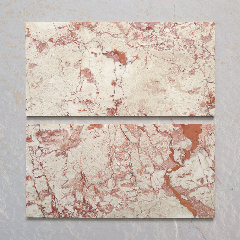 Group of two Fitzrovia Sylvester Pink honed natural marble tiles in a 30.5cm x 61cm format, showcasing natural variation with soft blush pink, cream and warm terracotta veining for a luxurious, timeless natural stone finish.