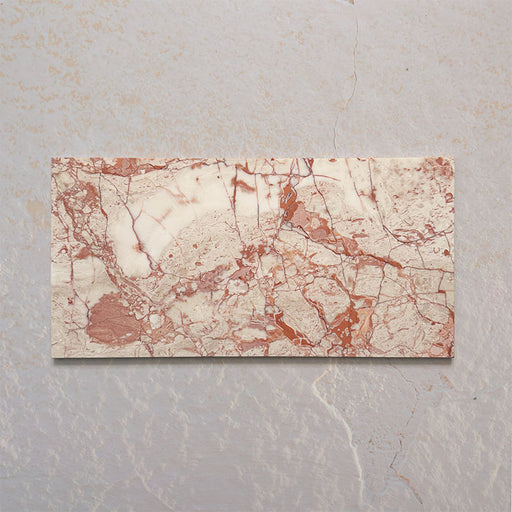 Sylvester Pink honed natural marble tiles in a 30.5cm x 61cm format, showcasing natural variation with soft blush pink, cream and warm terracotta veining for a luxurious, timeless natural stone finish.