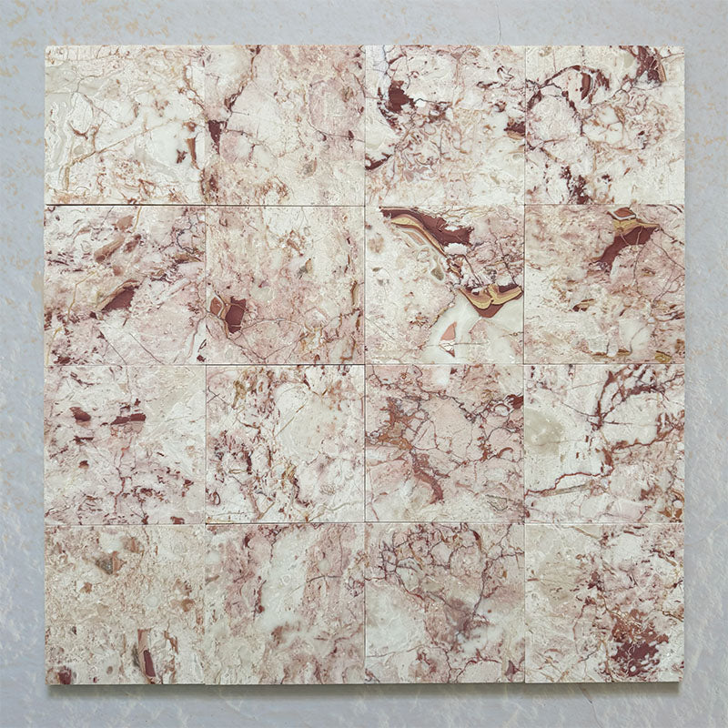Fitzrovia Sylvester Pink honed natural marble tile in a 15.2cm x 15.2cm square format, featuring soft blush pink, cream and warm terracotta veining with natural variation for a luxurious, timeless natural stone finish.