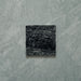 Close-up of Fitzrovia Verde tumbled natural marble tile in a 15.2cm x 15.2cm square format, featuring deep forest green tones with natural white veining, textured tumbled edges and an authentic aged stone finish.