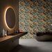 Bathroom featuring Forest Decor Dark 60x120cm botanical-style wall tiles, showcasing a dramatic tropical leaf design in deep green, bronze and earthy tones, paired with a freestanding black bath, black vanity and contemporary fittings.