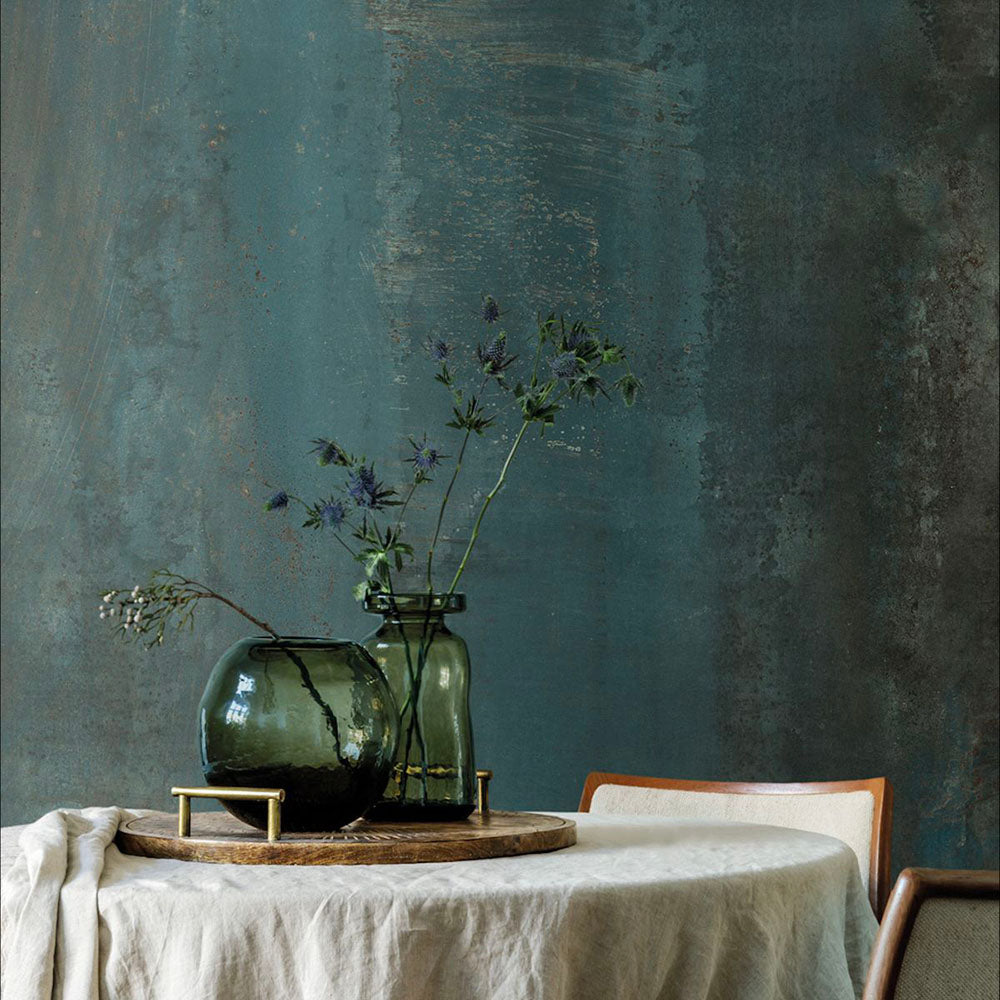 Interior setting featuring Furnace Cuprum Oxide Metallic 60 × 120cm porcelain wall tiles, showcasing deep blue-green tones layered with warm copper oxidation and soft tonal variation, paired with natural wood and glass accents for a rich, atmospheric, industrial-inspired finish.