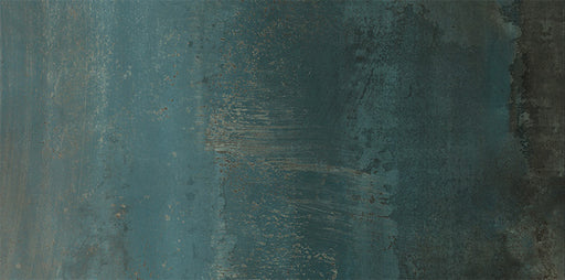 Close-up of Furnace Cuprum Oxide Metallic 60 × 120cm porcelain tile, showcasing deep blue-green tones layered with warm copper oxidation, soft tonal variation, and a gently textured metallic effect for a bold, industrial-inspired finish.