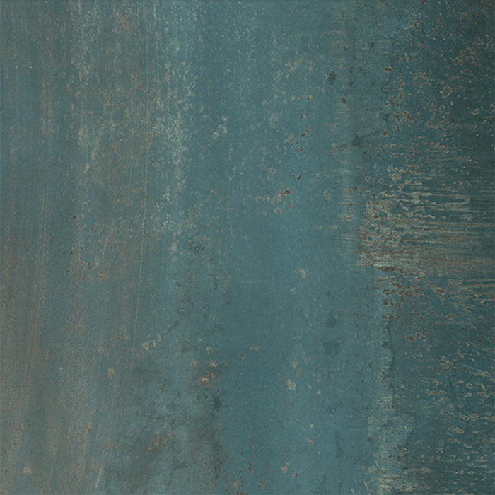 Close-up of Furnace Cuprum Oxide Metallic 60 × 60cm porcelain tile, featuring deep blue-green tones layered with warm copper oxidation, soft tonal variation, and a gently textured metallic effect for a rich, industrial-inspired finish.