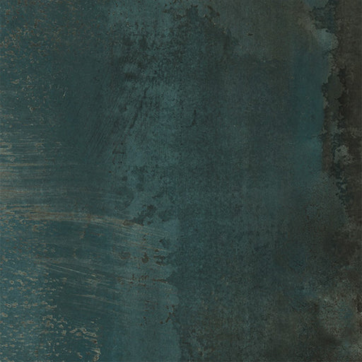 Close-up of Furnace Cuprum Oxide Metallic 60 × 60cm porcelain tile, featuring deep blue-green tones layered with warm copper oxidation, soft tonal variation, and a gently textured metallic effect for a rich, industrial-inspired finish.