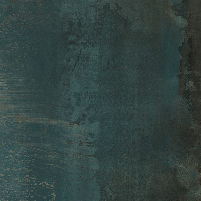 Close-up of Furnace Cuprum Oxide Metallic 60 × 60cm porcelain tile, featuring deep blue-green tones layered with warm copper oxidation, soft tonal variation, and a gently textured metallic effect for a rich, industrial-inspired finish.