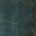 Close-up of Furnace Cuprum Oxide Metallic 60 × 60cm porcelain tile, featuring deep blue-green tones layered with warm copper oxidation, soft tonal variation, and a gently textured metallic effect for a rich, industrial-inspired finish.