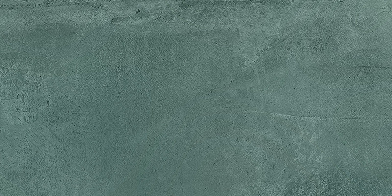 Close-up of Furnace Emerald Green Oxide Metallic 60 × 120cm porcelain tile, showcasing deep green tones with soft tonal variation, a gently textured surface, and a subtle metallic effect for a contemporary, industrial-inspired finish.