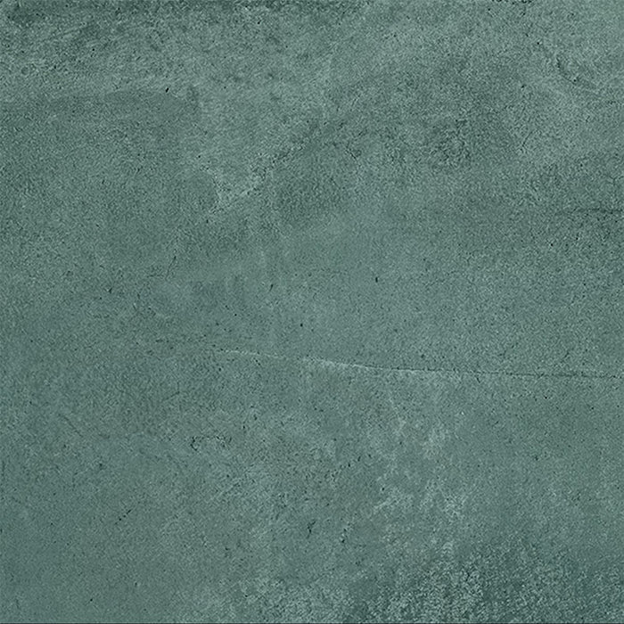 Close-up of Furnace Emerald Green Oxide Metallic 80 × 80cm porcelain tile, showcasing deep green tones with soft tonal variation, a gently textured surface, and a subtle metallic effect that brings depth and a contemporary, industrial-inspired finish to interior spaces.