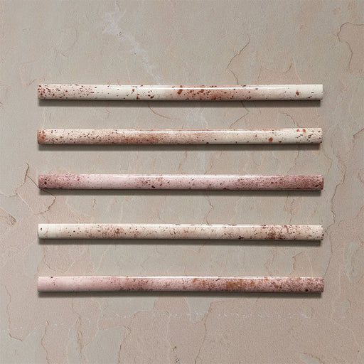 Fusion Coral Pink 1.5x30cm gloss pencil bullnose border tiles featuring soft blush and terracotta speckled tones, designed for decorative edging and refined finishing details in contemporary wall tile installations.