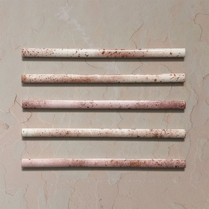 Fusion Coral Pink 1.5x30cm gloss pencil bullnose border tiles featuring soft blush and terracotta speckled tones, designed for decorative edging and refined finishing details in contemporary wall tile installations.