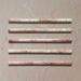Fusion Coral Pink 1.5x30cm gloss pencil bullnose border tiles featuring soft blush and terracotta speckled tones, designed for decorative edging and refined finishing details in contemporary wall tile installations.