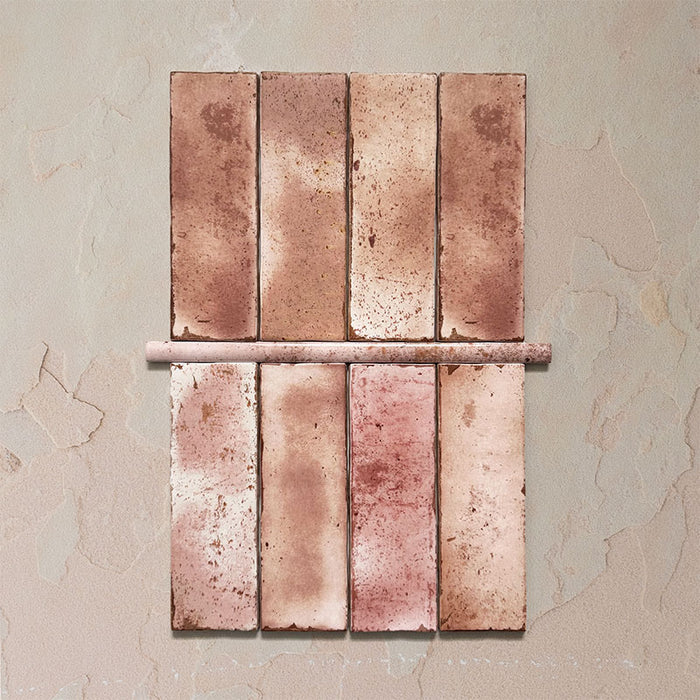 Fusion Coral Pink 1.5x30cm gloss pencil bullnose border tiles featuring soft blush and terracotta speckled tones, designed for decorative edging and refined finishing details in contemporary wall tile installations.