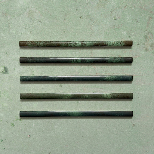 Fusion Jade Green 1.5x30cm gloss pencil bullnose border tiles featuring rich green and charcoal tonal variation, designed for decorative edging and refined finishing details in contemporary wall tile installations.