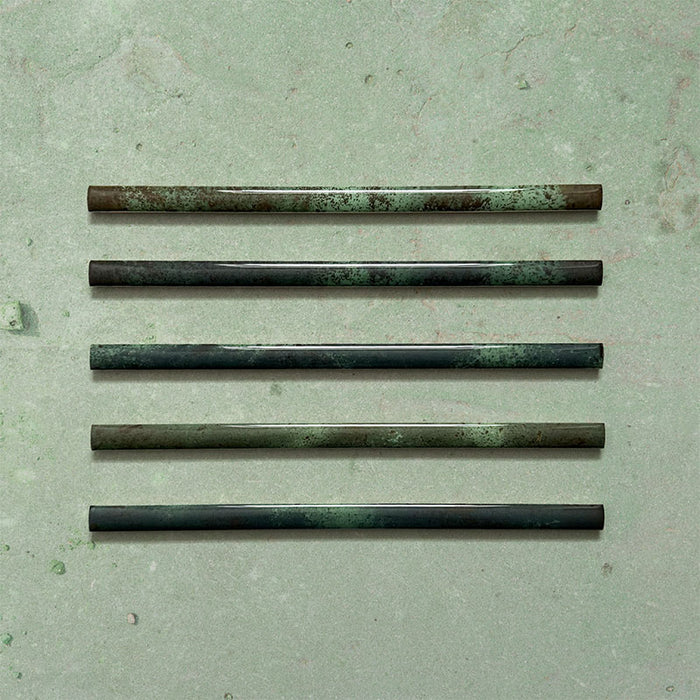 Fusion Jade Green 1.5x30cm gloss pencil bullnose border tiles featuring rich green and charcoal tonal variation, designed for decorative edging and refined finishing details in contemporary wall tile installations.