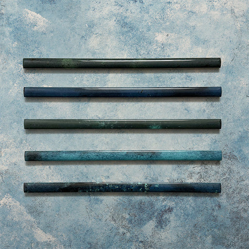 Fusion Marine Blue 1.5x30cm gloss pencil bullnose border tiles featuring deep navy and teal tonal variation, designed for decorative edging and refined finishing details in contemporary wall tile installations.