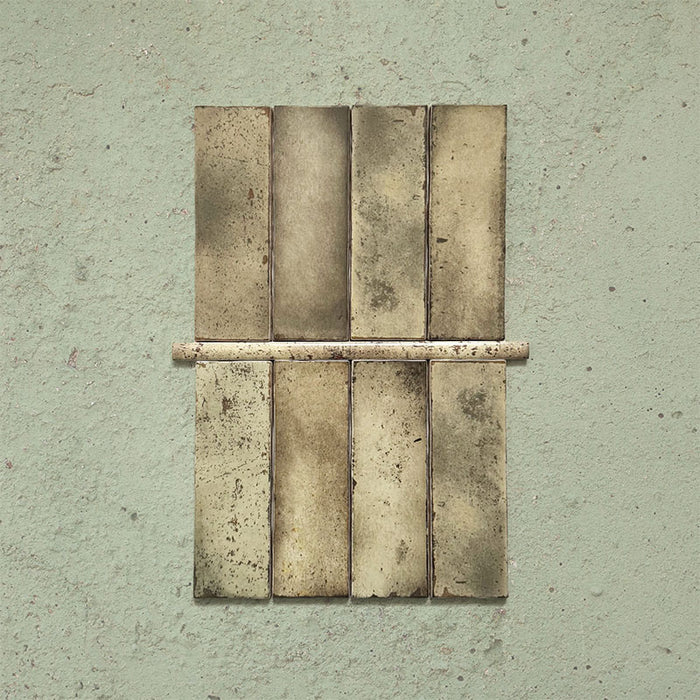 Fusion Moss Green 1.5x30cm gloss pencil bullnose border tiles featuring earthy olive and stone-toned speckled variation, designed for decorative edging and refined finishing details in contemporary wall tile installations.