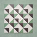 Group layout of Geometry Angles Patterned Tiles in 20cm x 20cm, arranged in a repeating geometric pattern featuring green, white, and black triangular shapes forming interlocking diamond motifs, displayed on a textured green background.