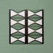 Group image showing four Geometry Hourglass 20x20cm patterned tiles arranged in a repeating vertical design, featuring alternating green and cream hourglass shapes outlined in charcoal, photographed against a textured sage-green background.