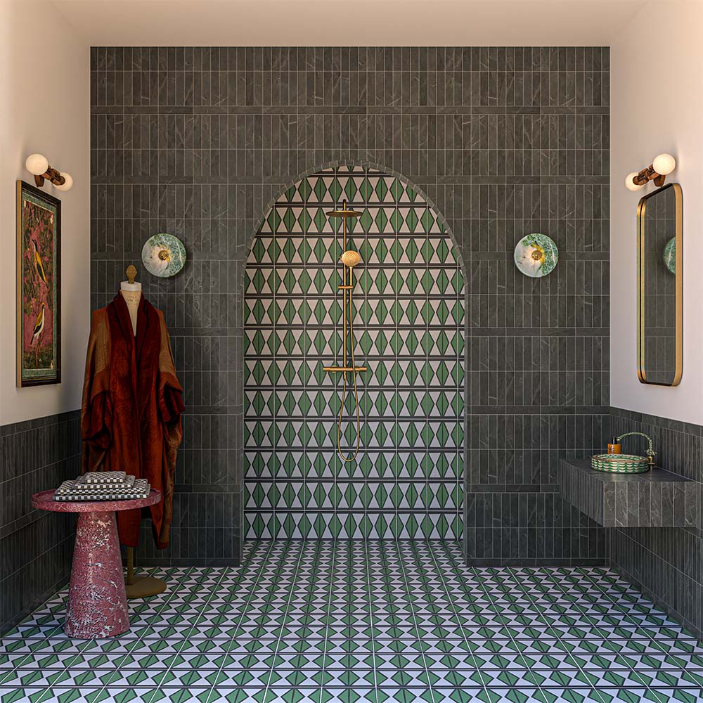 Bathroom featuring Geometry Hourglass 20cm x 20cm patterned floor tiles, paired with dark fluted wall tiles, an arched walk-in shower, brushed brass fittings, floating vanity and bold geometric green feature tiles.