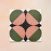 Group image showing four Geometry Moon 20x20cm geometric patterned tiles arranged to form a circular motif, featuring green and terracotta semicircles with black and cream corner details, photographed against a soft peach-toned background.